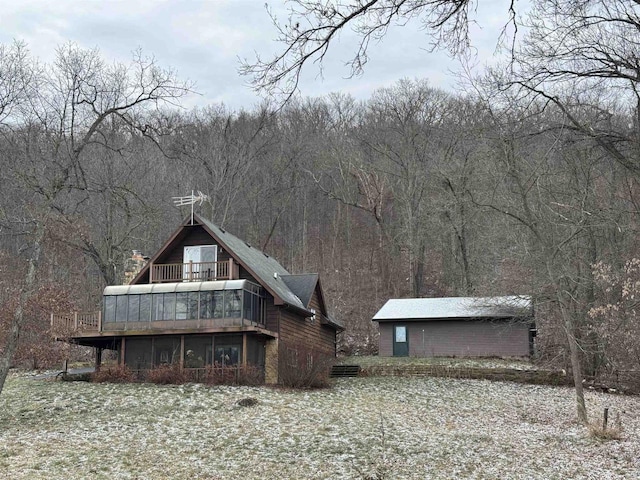 7409 Timberline Trl, Arena, WI 53503 - back of property featuring a sunroom and a view of trees