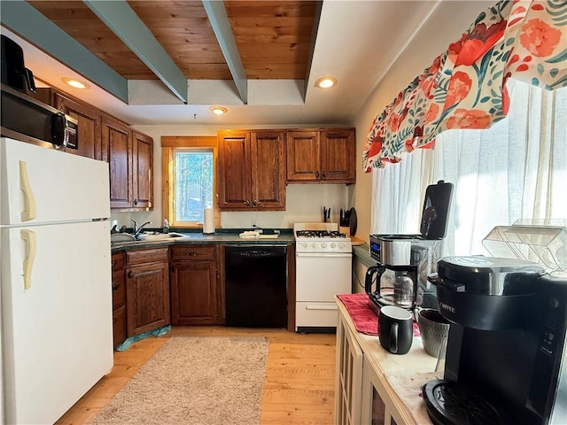 kitchen with beam ceiling, white appliances, light hardwood / wood-style flooring, and sink