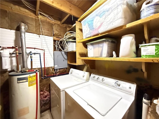 clothes washing area featuring washer and clothes dryer, electric panel, and water heater