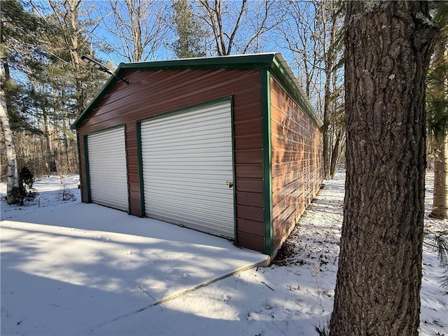 view of snow covered garage