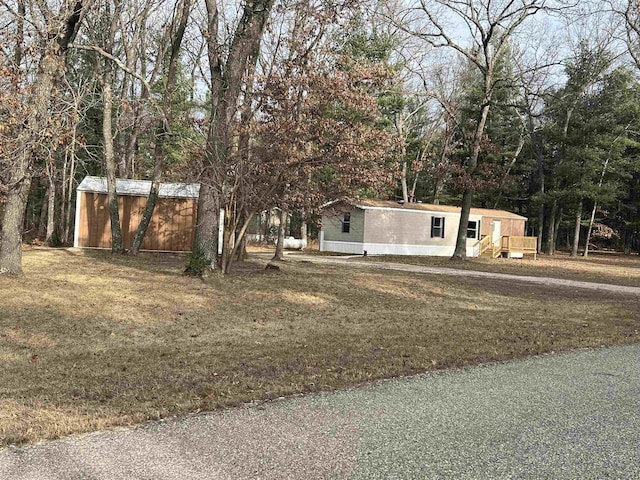 view of front of home with a shed