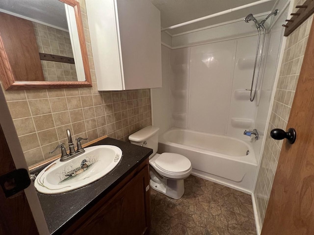 full bathroom with washtub / shower combination, tasteful backsplash, toilet, vanity, and tile walls