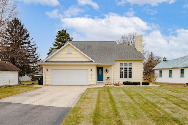 view of front of house with a front lawn and a garage