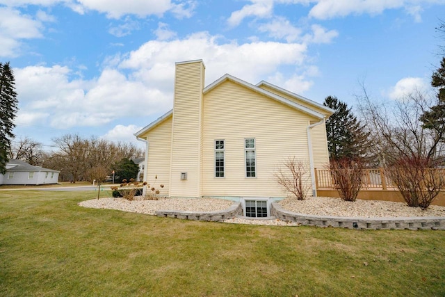 view of side of property with a lawn