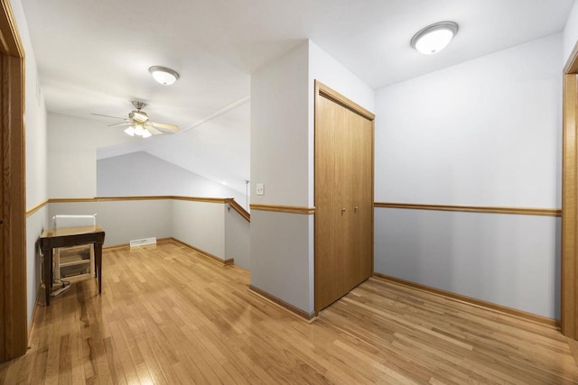 bonus room featuring ceiling fan, lofted ceiling, and light wood-type flooring