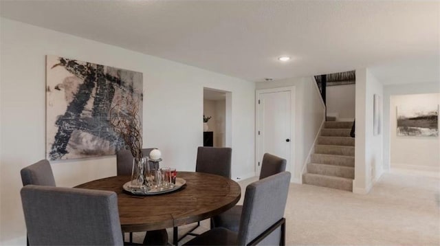 dining area with carpet flooring