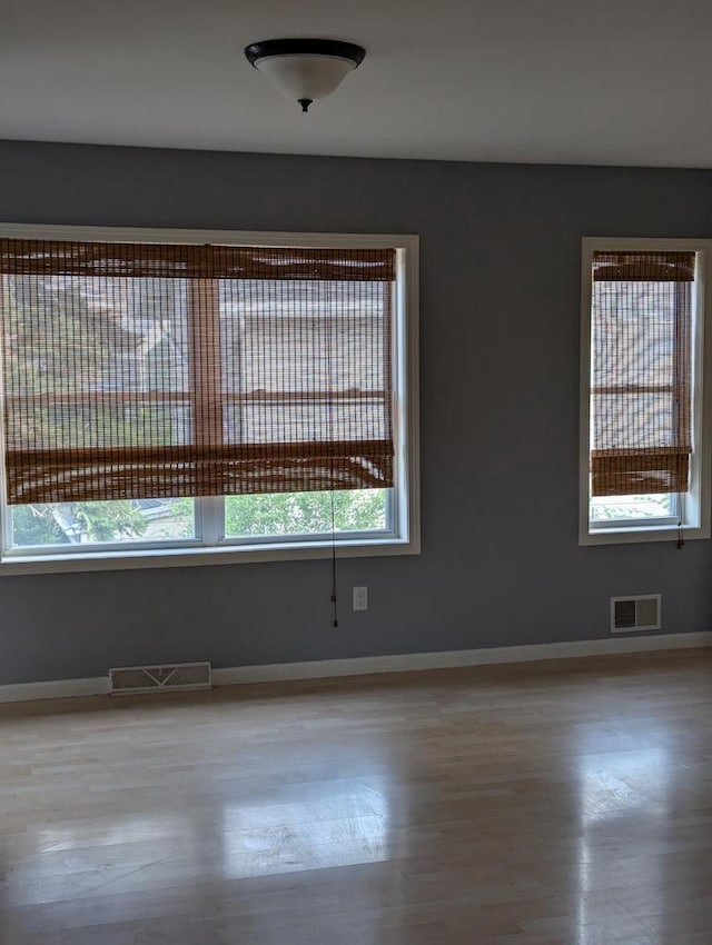 unfurnished room featuring light hardwood / wood-style flooring