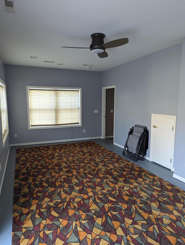 empty room featuring ceiling fan