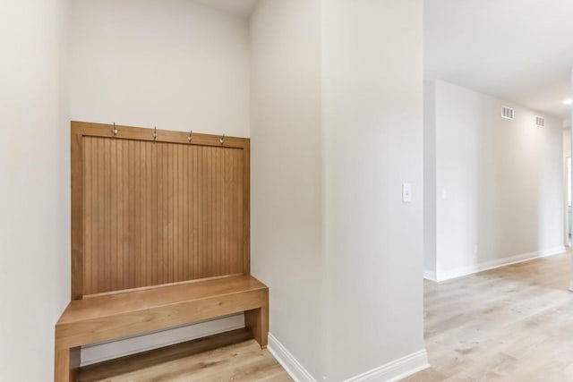 mudroom with light hardwood / wood-style floors