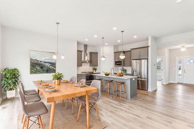 dining space featuring light hardwood / wood-style floors