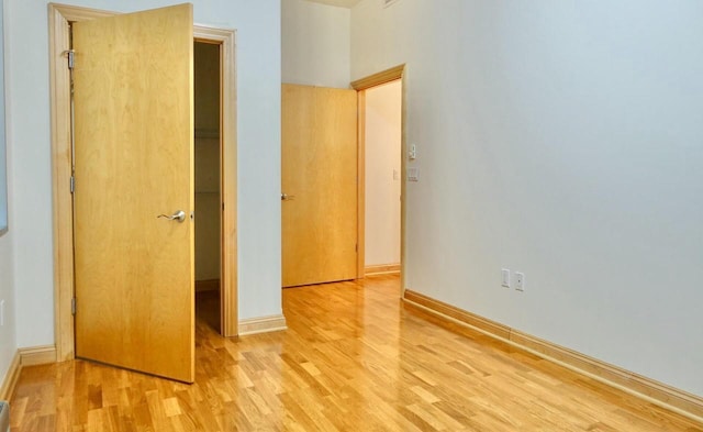 unfurnished bedroom featuring light wood-type flooring