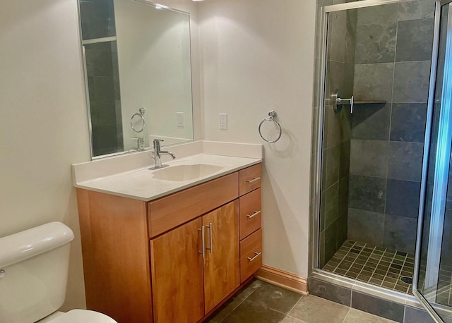 bathroom with walk in shower, tile patterned floors, vanity, and toilet