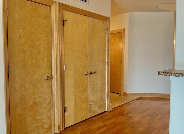 hallway with light wood-type flooring