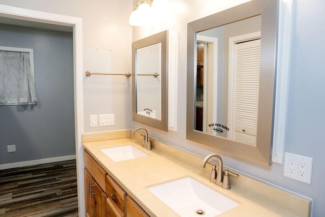 bathroom with vanity and hardwood / wood-style flooring