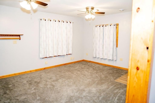 spare room with carpet and ceiling fan