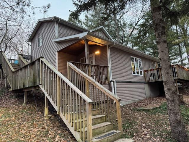 rear view of property with a deck