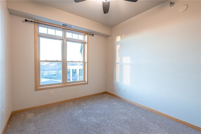 empty room with carpet and ceiling fan