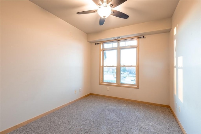 carpeted empty room featuring ceiling fan