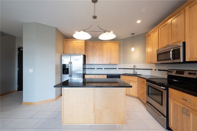 kitchen featuring a center island, sink, stainless steel appliances, and light brown cabinetry