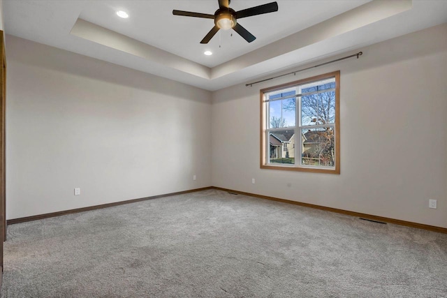 5550 N Amethyst Dr, Appleton, WI 54913 - carpeted empty room with a tray ceiling and ceiling fan