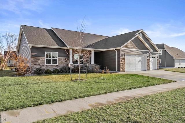 view of front of house featuring a front yard and a garage