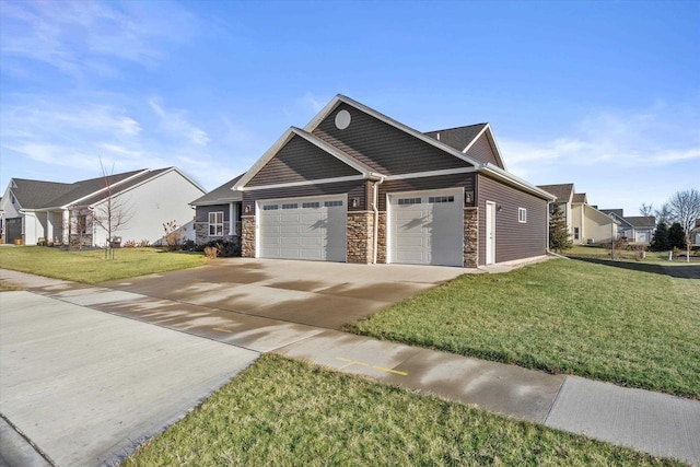 5550 N Amethyst Dr, Appleton, WI 54913 - view of front of house with stone siding, an attached garage, a front lawn, concrete driveway, and a residential view