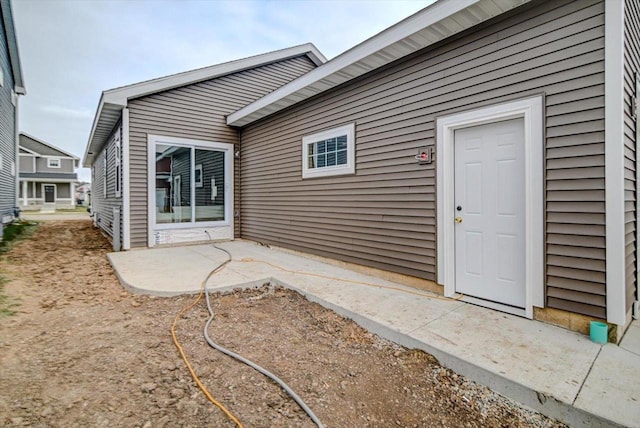 doorway to property with a patio