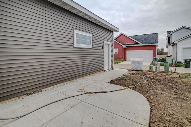 view of property exterior with a garage