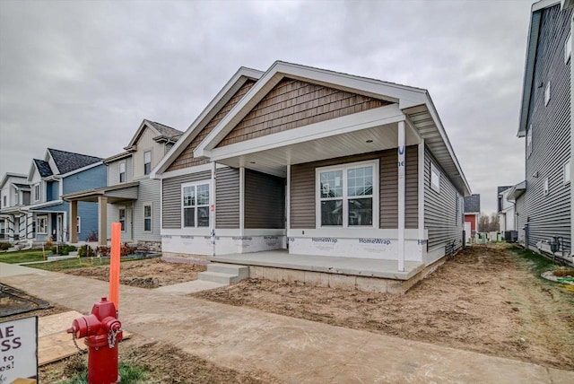 view of front of home with central AC unit and covered porch