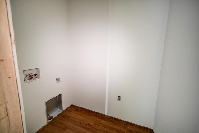 clothes washing area with washer hookup and dark wood-type flooring