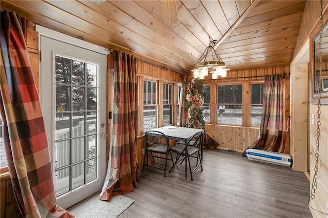 sunroom / solarium with a chandelier, wood ceiling, and lofted ceiling