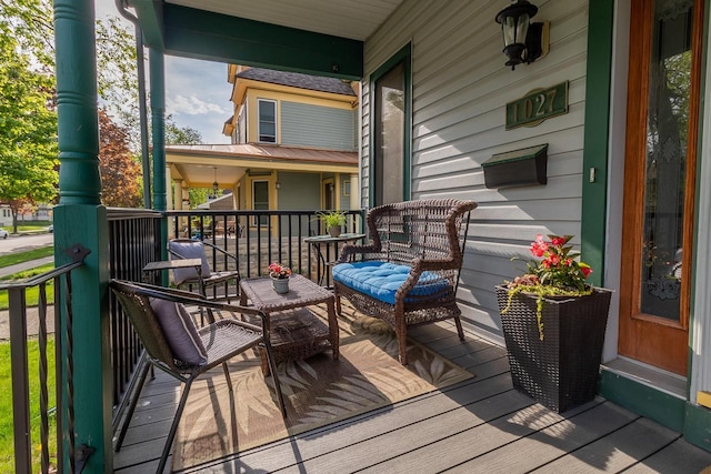 wooden terrace with a porch