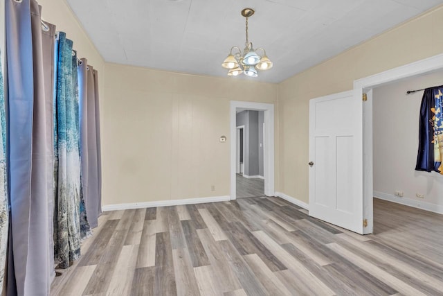 interior space featuring a notable chandelier and light hardwood / wood-style floors