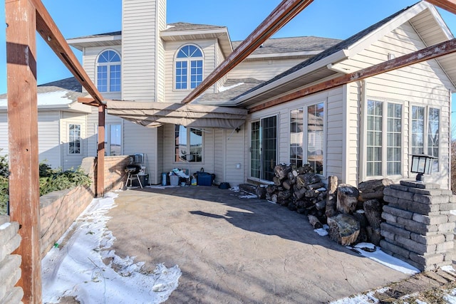 rear view of property with a patio