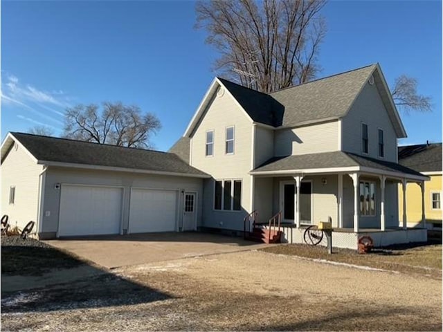 view of front of house featuring a porch and a garage