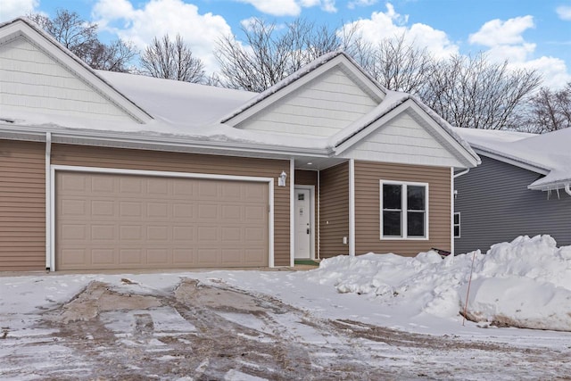 view of front of property with a garage