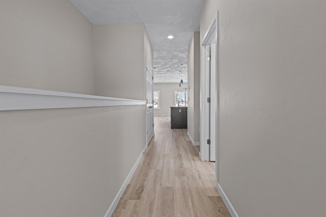 corridor featuring light hardwood / wood-style flooring