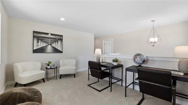 sitting room with baseboards, carpet floors, and a notable chandelier