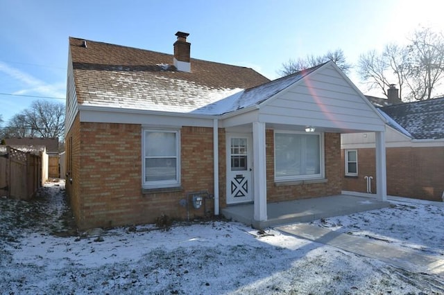 view of snow covered house