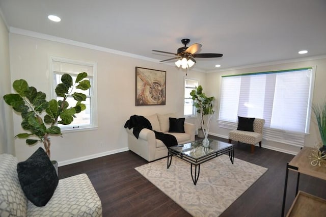 living room with dark hardwood / wood-style floors, ceiling fan, and crown molding