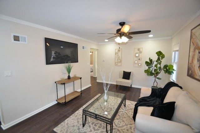 living room featuring ornamental molding, ceiling fan, and dark wood-type flooring