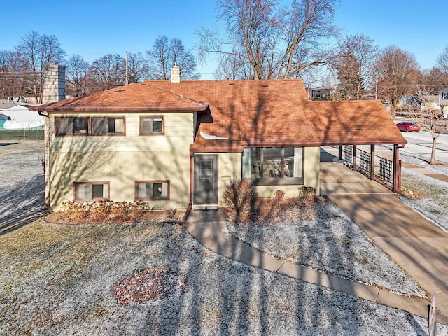 view of front of property with a carport