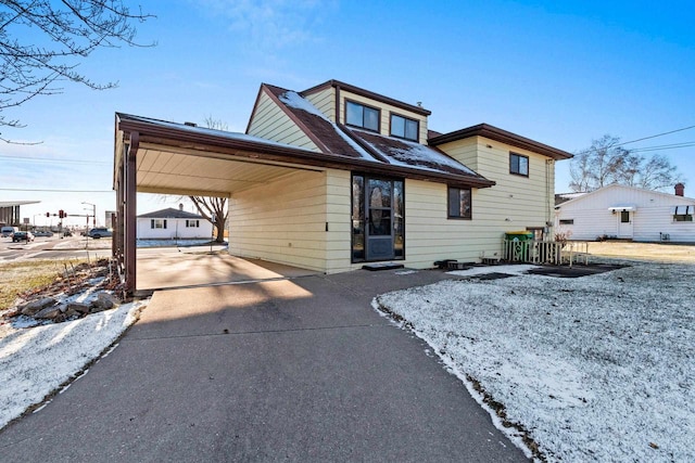 view of front of property featuring a carport