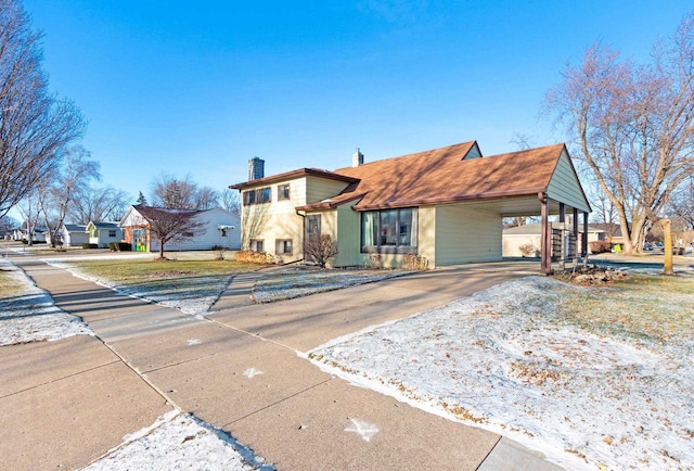 view of front of home with a carport