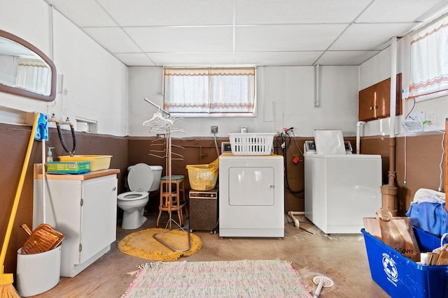 laundry room with separate washer and dryer and a wealth of natural light