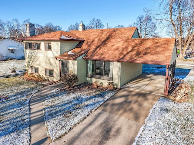 view of front of home with a carport