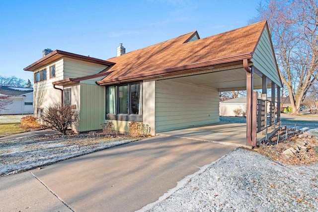 view of front of home with a carport