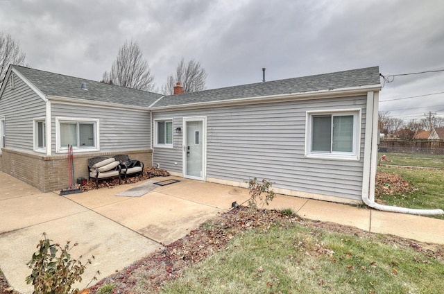 back of property featuring a patio