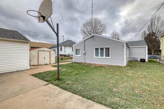 exterior space with a lawn and a storage unit