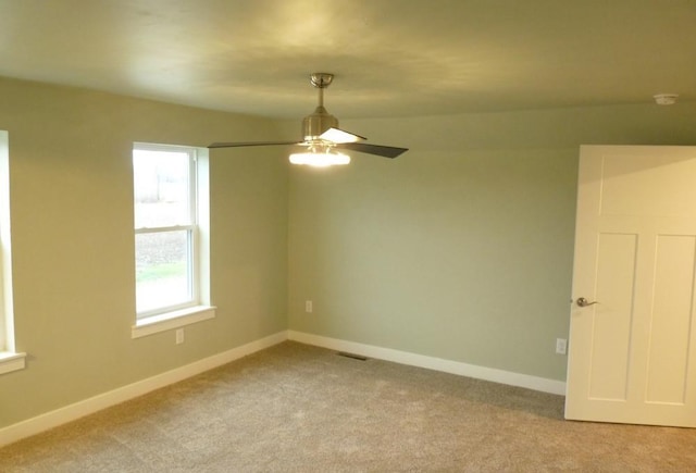 carpeted empty room with ceiling fan